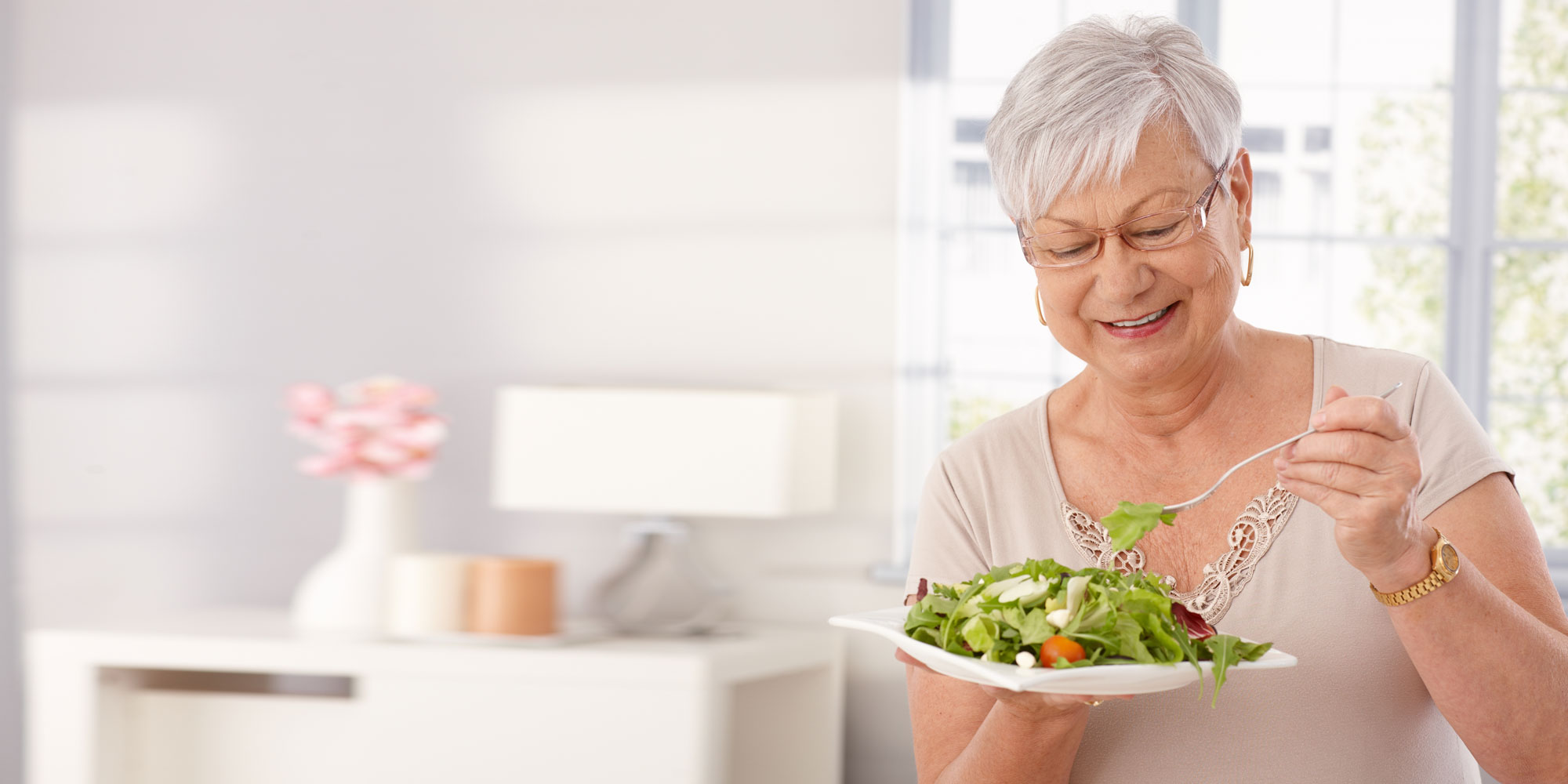 A denture patient eating comfortably