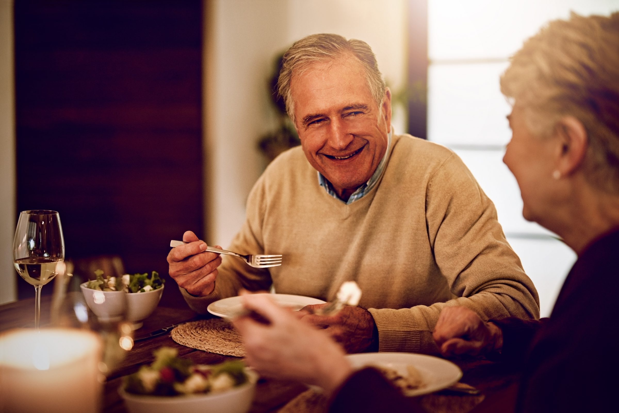An older couple enjoying a meal together