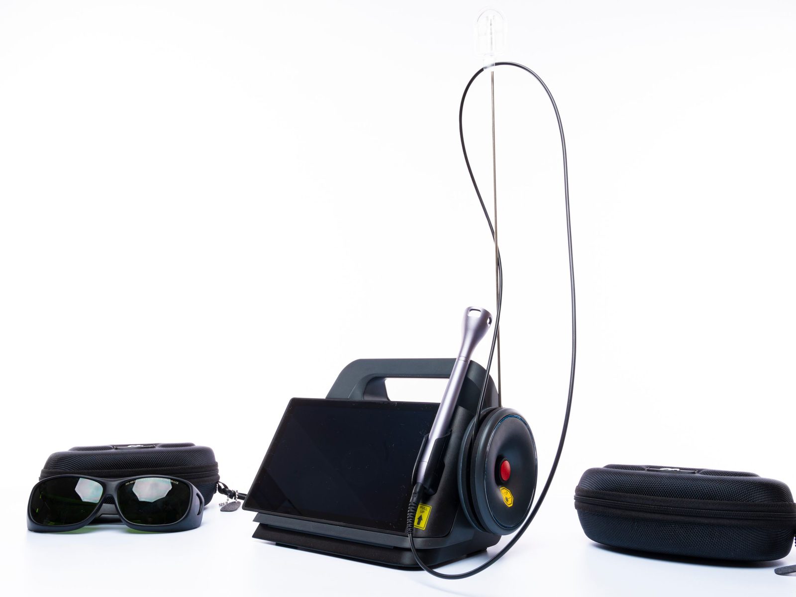 A dental diode laser with its handpiece and protective glasses