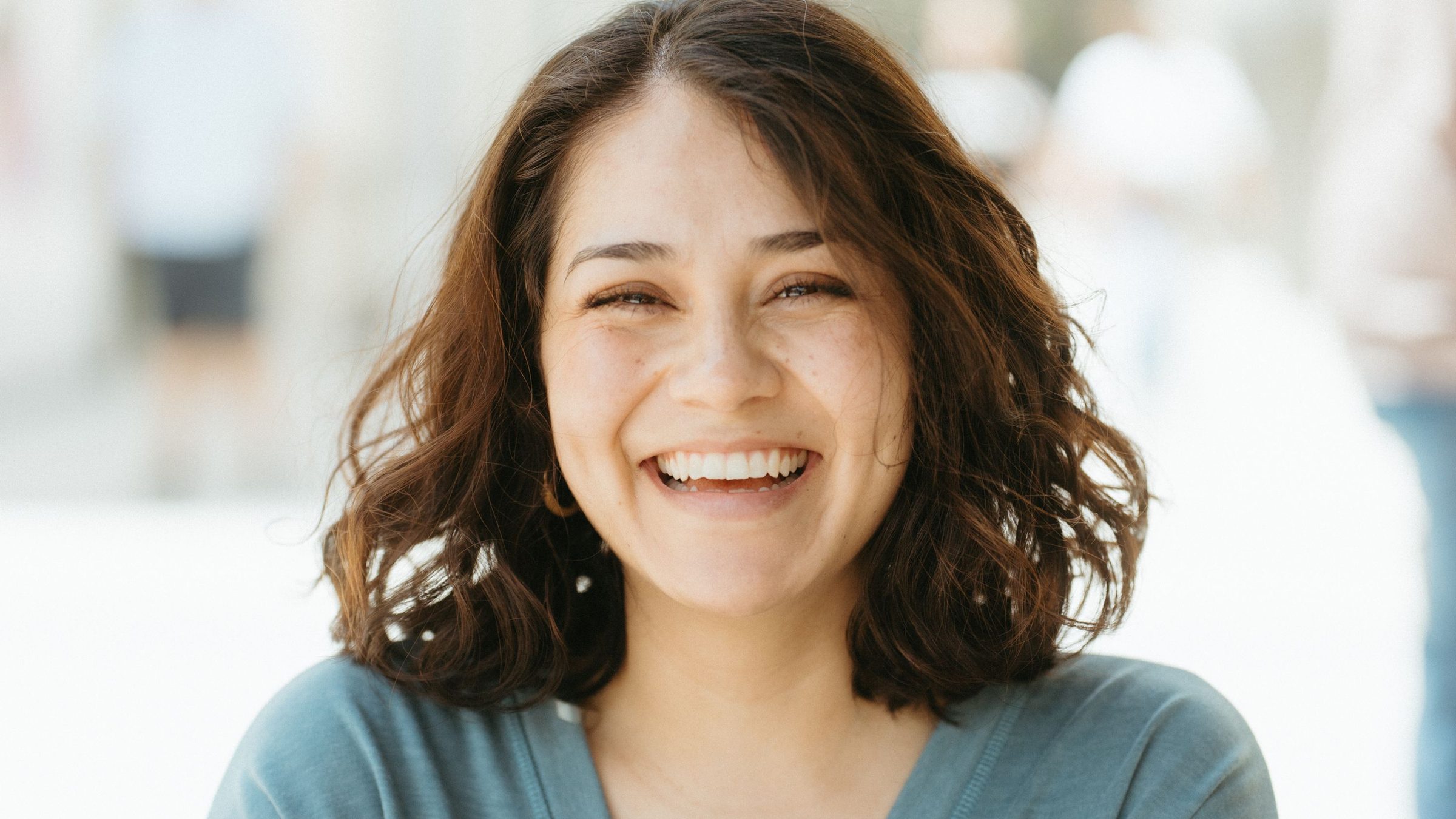 A woman with a bright, natural smile