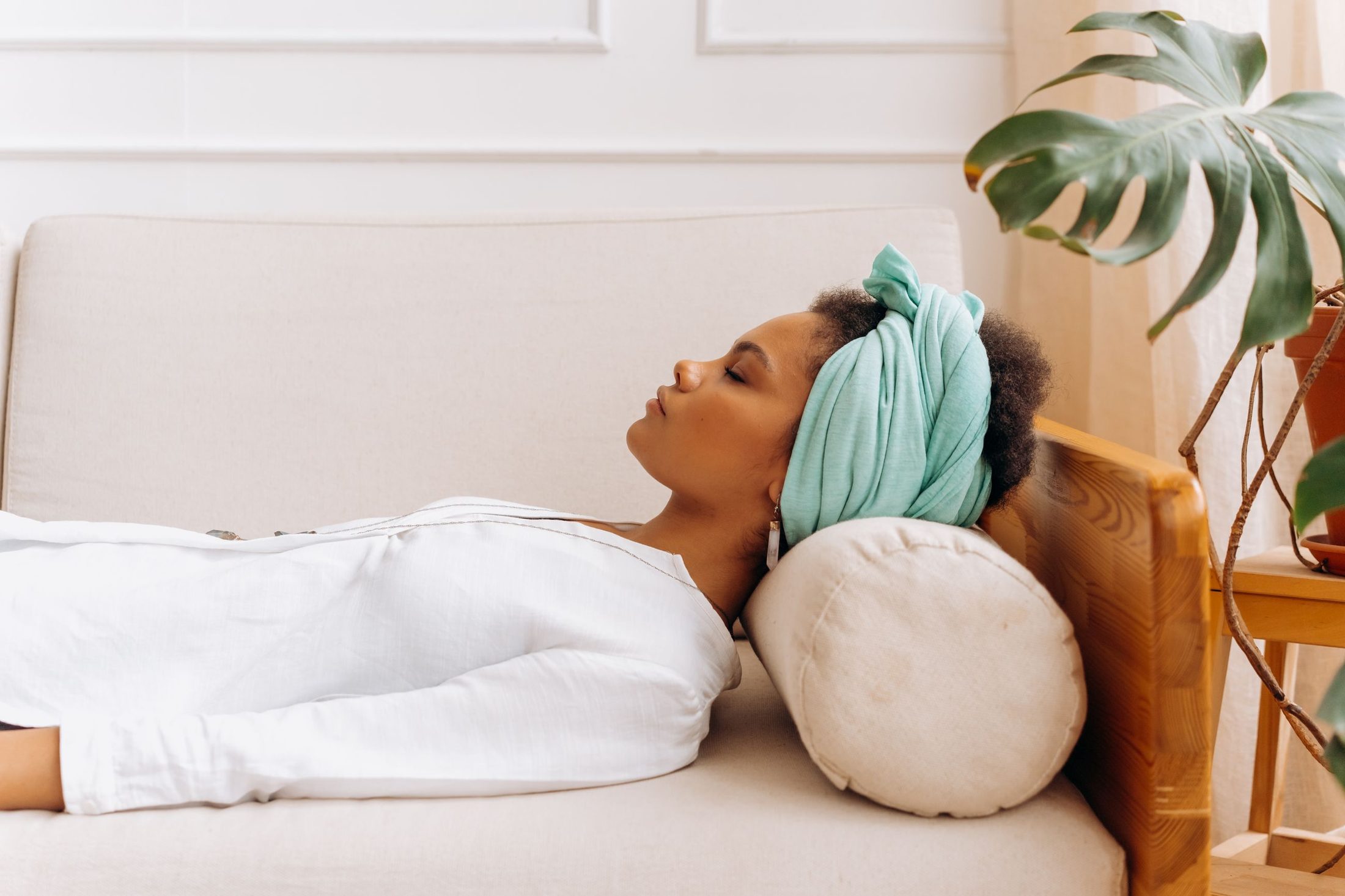 A woman resting on the sofa at home