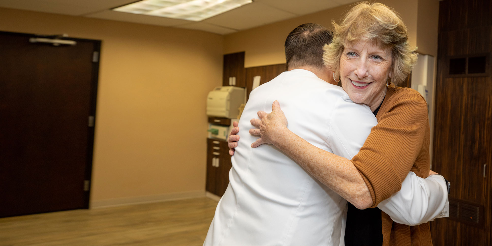 Leslie with Dr. Barriere after her full-arch treatment