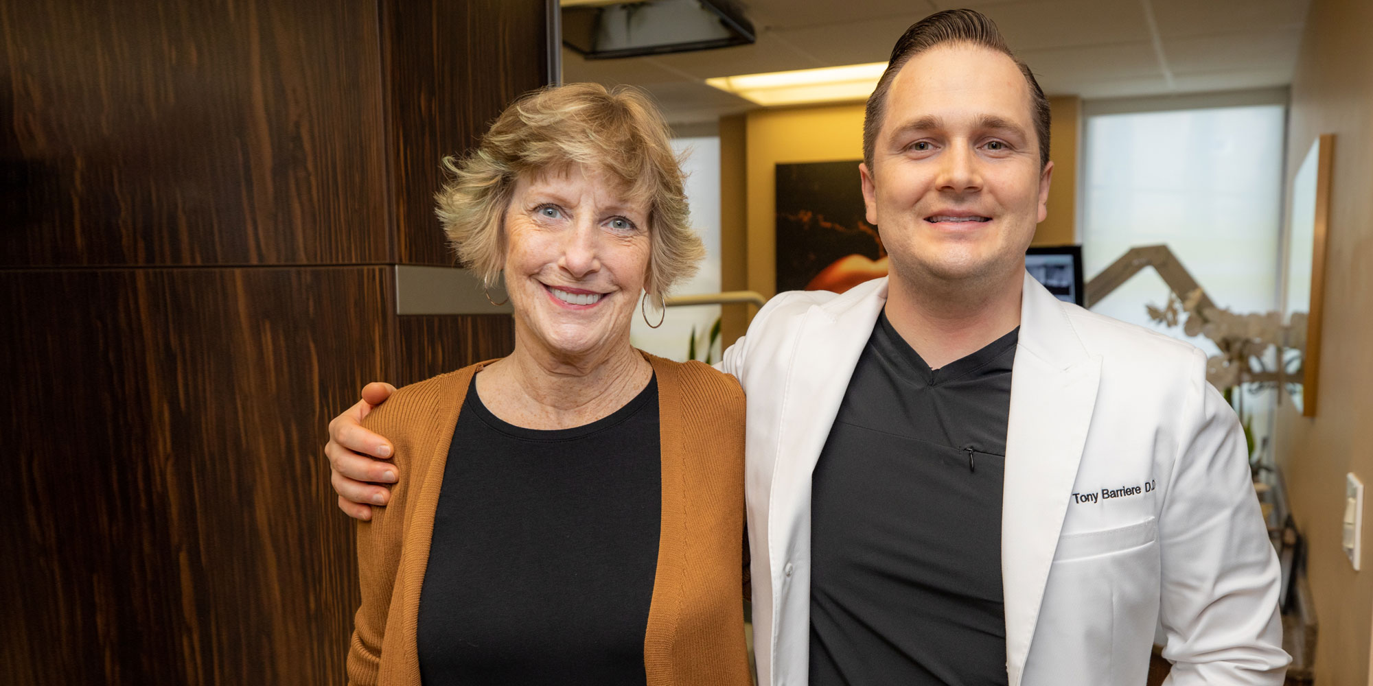 Dr. Barriere with Leslie after her full-arch treatment