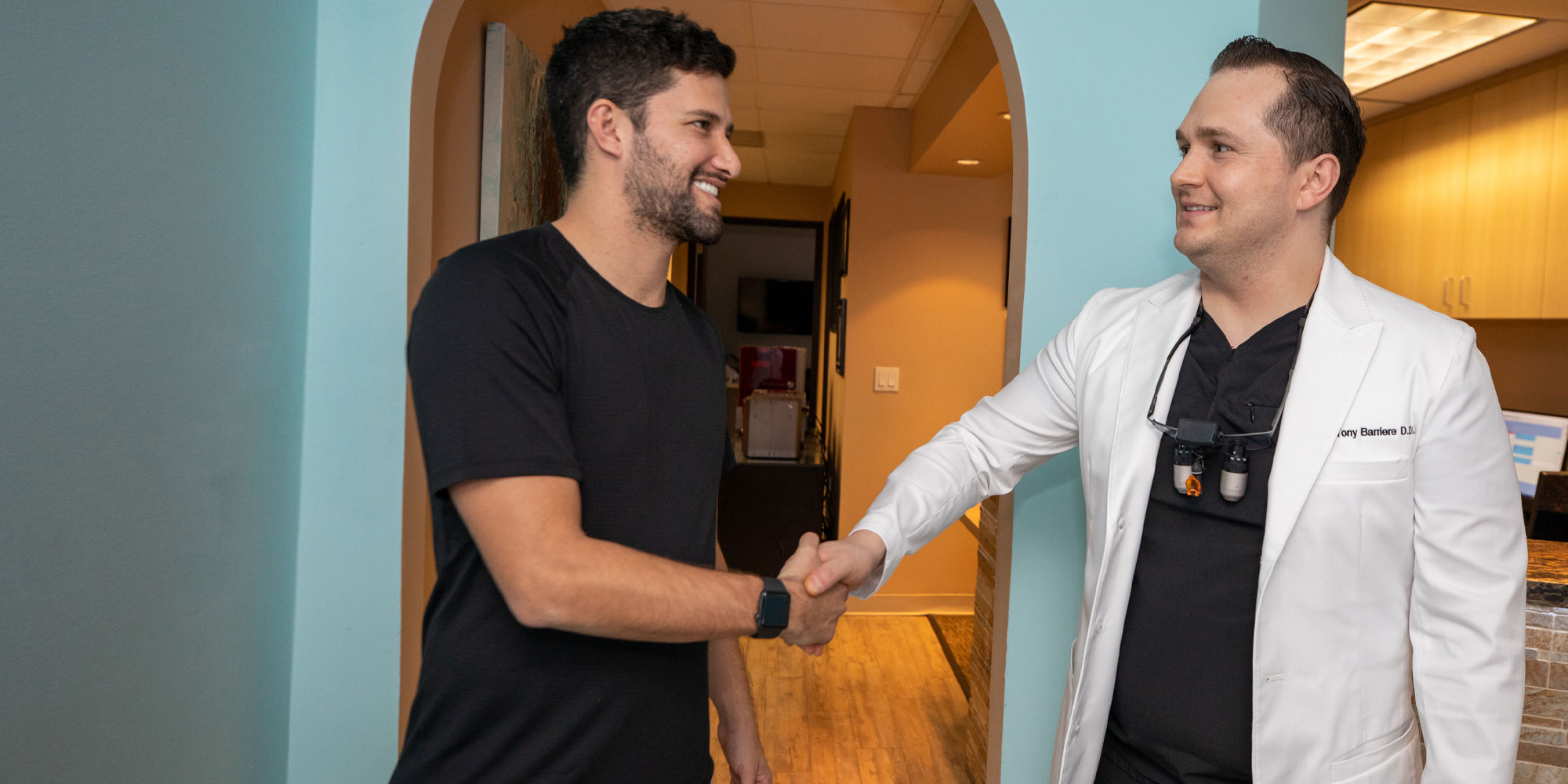 Dr. Barriere greeting a patient